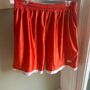 These are orange STARTER shorts in the size men’s medium